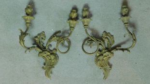 A pair of gilt metal Rococo style twin branch wall candelabras. H.40 W.28 (previously wired for