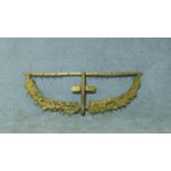 An antique gilded brass bracket with individual oak leaf decoration and hanging clip hooks. H.36 W.