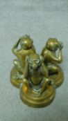 An antique Oriental brass figure group of the Three Monkeys. See no evil, hear no evil and speak