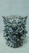 An Edge growling grey wolf sculpture by Matt Buckley, originally sculpted from clay, each piece then