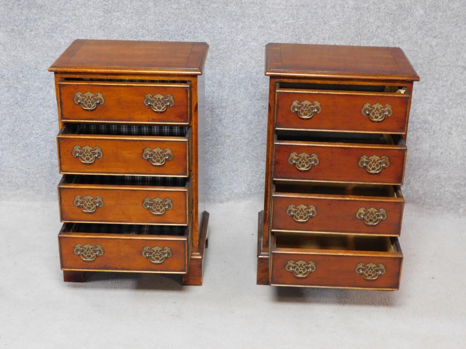 A pair of Georgian style yew wood and crossbanded bedside chests of four drawers on bracket feet. - Image 2 of 4