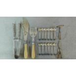 A collection of silver plated cutlery. Including a set of carved twist ivory handled fish servers, a