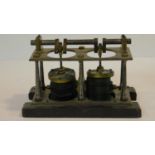 An antique brass and steel model of a steam engine mounted on a wooden base. H.17 W.25 D.14cm