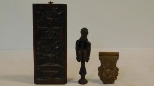 A collection of antique carved wooden treen items. Including an antique carved fruitwood crouching