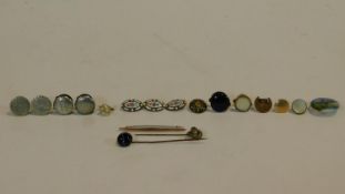 A collection of buttons and studs, mother of pearl carved knot, four french enamel buttons, a hand