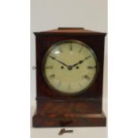 A Regency mahogany cased bracket clock with white painted dial and Roman numerals on plinth base.