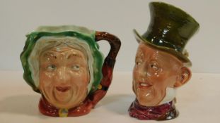Two Beswick character mugs, a lady and a top hatted gentleman. H.23cm