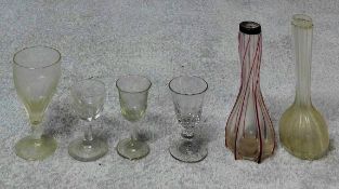 A collection of antique glass. Including four antique glasses with two Victorian ribbed glass bottle