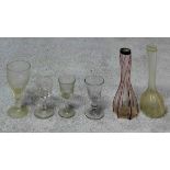 A collection of antique glass. Including four antique glasses with two Victorian ribbed glass bottle