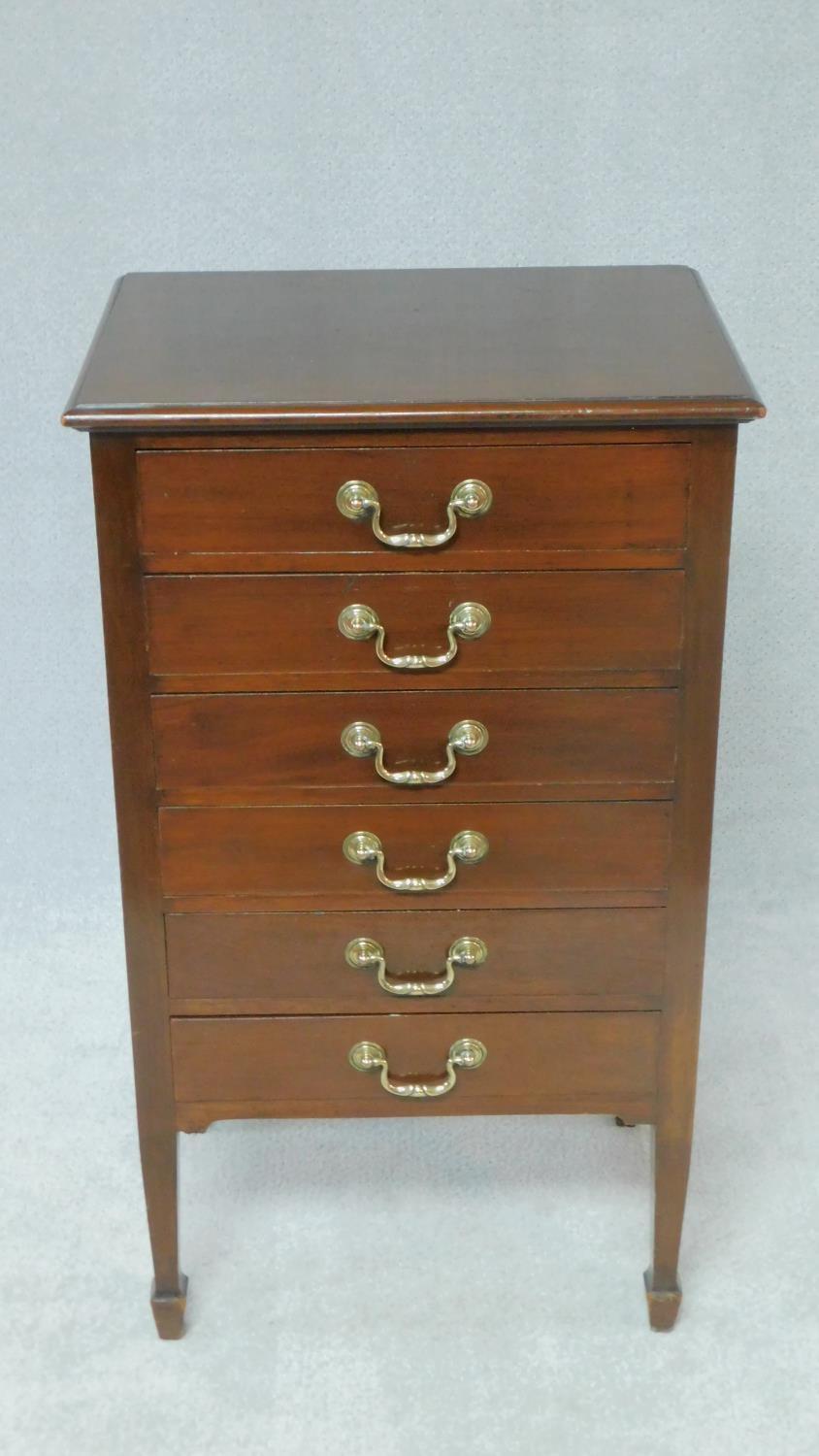 An Edwardian mahogany music chest with six drop front sheet music drawers. H.88 W.50 D.38cm