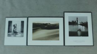 A collection of three framed and glazed black and white photographic posters, various subjects.