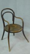 A late 19th century child's bentwood armchair, Vienna makers stamp to the underside. H.80cm