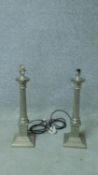 A pair of metal Corinthian column table lamp bases. H.50cm