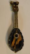 A miniature tortoiseshell mandolin with mother of pearl inlay. W.11cm