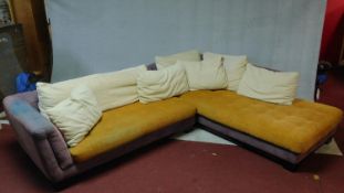 A corner sofa in two sections together with its scatter cushions with makers mark, Maurice Villency,