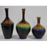 A collection of three Persian drip glazed vases of bulbous form. H.34cm
