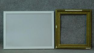 A white lacquered contemporary picture frame and a gilt wood and gesso frame. 53x71cm - outside -
