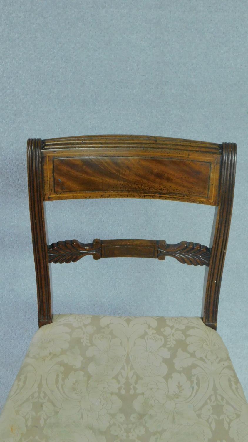 A set of five late Georgian mahogany and satinwood inlaid dining chairs in damask stuffover seats on - Image 5 of 5