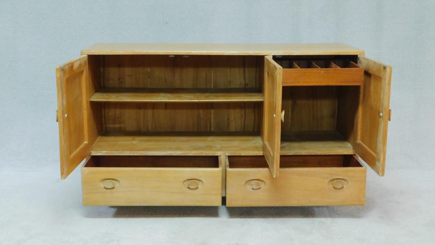 A vintage blonde elm Ercol sideboard, model 468, with an arrangement of drawers and cupboards raised - Image 2 of 5