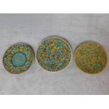 A collection of three Persian shallow bowls with allover polychrome floral glaze. 45x45cm