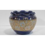 A Royal Doulton stoneware jardiniere, Slaters Patent, in deep blue glaze with textured ground of