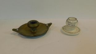 An Art Nouveau style brass inkwell along with an antique Royal Doulton advertising match striker, '