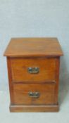 An Eastern teak side cabinet fitted with two deep drawers on plinth base. W.64 D.64cm
