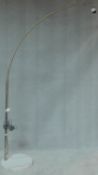 A chromium floor standing arc lamp on marble base, lacks shade. H.218 W.45 D.45cm