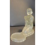 An Art Deco frosted glass sculpture of a kneeling woman offering a bowl with circular platform.