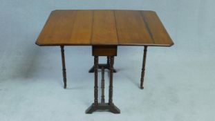 A late 19th century walnut Sutherland table with twin drop flaps on turned tapering supports. H.85