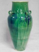 A large floor standing turquoise drip glazed Sharab wine vessel of bulbous form. H.90cm