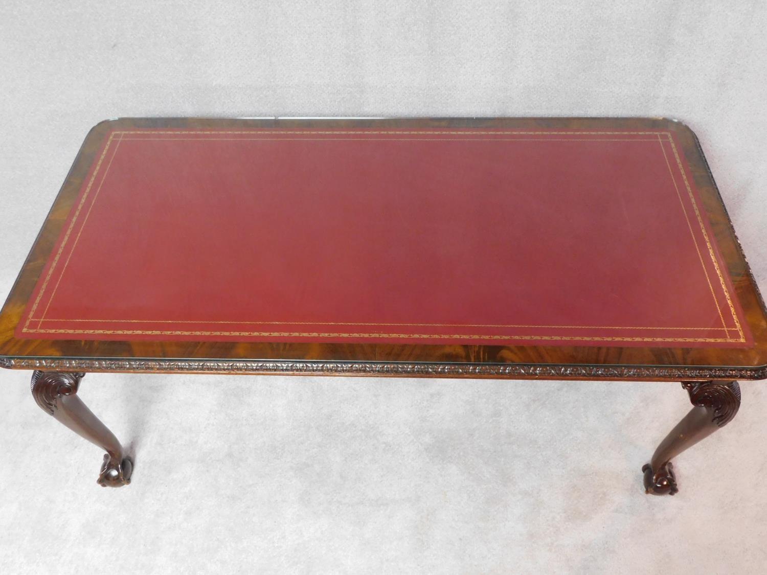 A mid Georgian style mahogany library table with inset tooled leather top on carved cabriole - Image 2 of 4