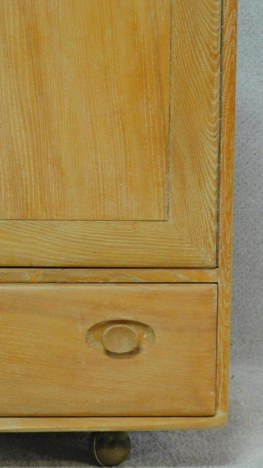 A vintage blonde elm Ercol sideboard, model 468, with an arrangement of drawers and cupboards raised - Image 5 of 5