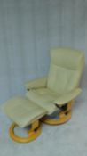 An Ekornes reclining armchair in cream leather on a sprung laminated base along with the matching