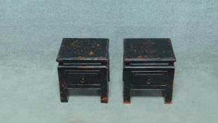 A pair of small Chinese style ebonised low tables with frieze drawers on square supports. H.34 W.