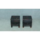 A pair of small Chinese style ebonised low tables with frieze drawers on square supports. H.34 W.