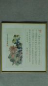 A framed and glazed 20th century Chinese silk painting of chrysanthemums and foliage with