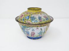 A late Qing Canton enamel lidded tea bowl. Decorated with Chinese figures and flowers on an imperial