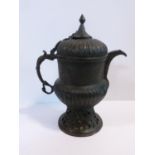 An 18th century Islamic pierced and engraved bronze samovar. Animal form handle and stylized