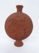 A late Meji -Taisho period unglazed terracotta dragon design moon flask. h11cm