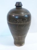 A 19th century Chinese Cizou ware type glazed pottery vase with fish and scrolling motif design.