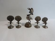 Four Indian white metal peacocks intricately engraved menu/card holders and a white metal statue