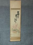 A Japanese mounted scroll, silk painting, coiled snake embroidery and cherry blossom, signed.