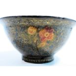 A mid to late 19th century gold painted lacquered paper mache Kashmiri bowl of hemispherical shape