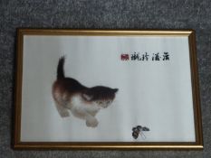 A framed and glazed Japanese silk cat embroidery with butterfly. Embroidered artist's seal mark