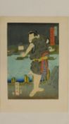 A Japanese wood block print by Utagawa Kuniharu. Artists seal mark. 34x23