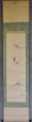 A Japanese mounted scroll, ink on paper, calligraphy with artist's seal. L.183x40cm.