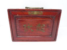 A 20th century Chinese hardwood cased mahjong set with bone and bamboo tiles contained in four