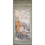 A Japanese mounted scroll, ink and watercolour on paper, a snarling tiger against a naturalistic