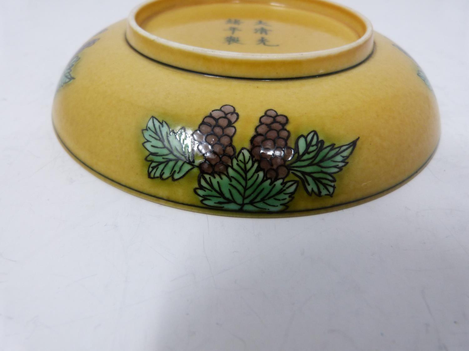 A Kangxi style porcelain golden-yellow ground Dragon dish, six-character Guangxu mark. Grape - Image 4 of 6